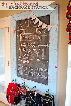 a chalkboard with writing on it in front of a door