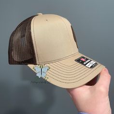 Gear up for your next outdoor adventure with our Morel Mushroom Leather Patch Richardson 112 Hat/Cap. The genuine leather patch adds a touch of rustic charm, while the adjustable strap ensures a comfortable fit. Show off your love for the great outdoors with this stylish and functional hat! The leather patch designs are affixed with adhesive for very secure attachment to the hat. Due to monitor colors, patches and hat colors may be slightly different in person. Custom leather patch hats are made from laser-engraved LEATHERETTE material. 60/40 cotton/polyester 100% polyester mesh back Structured, six-panel, mid pro profile Pre-curved bill Adjustable plastic snapback OSFM XL Crown Height approx 6 1/2" approx 6 1/2" Measurements 7" - 7 3/4" 7 1/4" - 7 7/8" Numerical Sizes Adjustable THIS IS A Brown Rugged Outdoor Hat, Beige Flat Bill Trucker Hat For Outdoor, Brown Flat Bill Hat For Camping, Brown Camping Hat, Adjustable Beige Snapback Hat For Outdoor, Brown Flat Bill Baseball Cap For Outdoor, Adjustable Beige Trucker Hat For Outdoor, Beige Adjustable Trucker Hat For Outdoor, Adjustable Casual Snapback Hat With Leather Patch