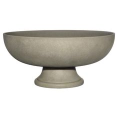 a large gray bowl sitting on top of a table