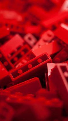 many red legos are stacked together on top of each other in the same pattern