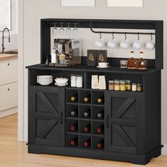 a kitchen bar with wine glasses and cups on it