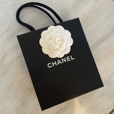 Authentic Chanel Shopping Gift Bag Luxury And Elegant Piece. Great For Gifting Or Home Decor White Shoulder Bag For Evening With Original Box, Elegant White Shoulder Bag Gift, Designer White Bags As Gifts, Designer White Bags For Gifts, Modern White Bag For Gift, Chanel Shopping, Chanel Black And White, Bag Luxury, Chanel Bags