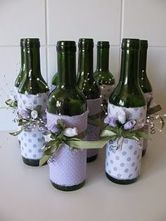 six wine bottles wrapped in polka dots and ribbons