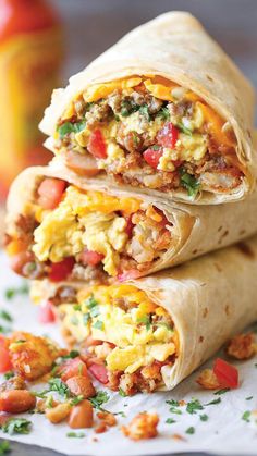 two burritos are stacked on top of each other