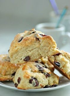 some scones are stacked on a plate