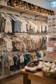 a clothing store with lots of baby clothes on display