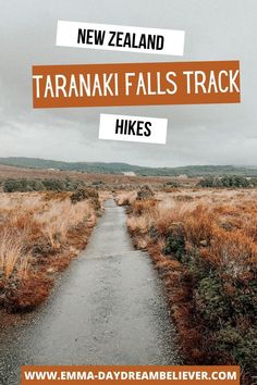 a road with the words new zealand taranaki falls track hikes on it