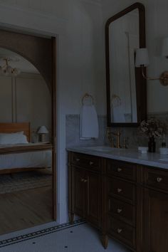 a bathroom with two sinks and a large mirror