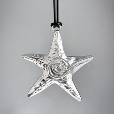 Description:Chic Embossed Starfish Pendant Wax String NecklaceSpecification:Length: 17.7" + 2.7" extWeight: 0.53 oz/pcsMaterial: alloy metal. wax stringColor: silver Features & Details:This embossed starfish pendant necklace is made of nickel-free. lead-free. cadmium-free and hypoallergenic materials. which will not turn your skin green or cause anaphylactic reaction.It is easy to match your different outfits and also suitable for any occasions like wedding. banquet. costume party. engaged party Starfish Charm Metal Necklace For Gift, Metal Necklace With Starfish Charm For Gift, Adjustable Silver Star Necklace, Silver Star-shaped Adjustable Necklace, Silver Starfish Necklace For Gift, Adjustable Silver Starfish Necklace, Silver Adjustable Starfish Necklace, Pendant Necklace Simple, Black Rope