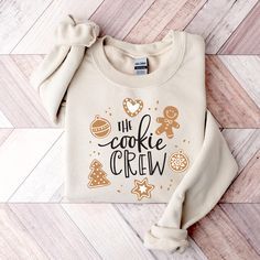 The Cookie Crew Sweatshirt, Cookie Lover Shirt, Cookie Sweater, Christmas Cookie T-Shirt, Christmas Gifts, Christmas Family Matching Shirt HOW TO ORDER 1️) Please review all the information provided below before placing an order. 2️) Select the shirt type and size. 3️) Select the color of the shirt using the following options. 4) Select your design (Personalization Box) if applicable. 5) Need more items? Add your current item to your cart and if you like to add more items to your order please cl Christmas Cookie Sweater, Cookie Sweater, Family Hoodie, Christmas Party Shirts, Family Humor, Christmas Family, Christmas Cookie, Crew Shirt, Gifts Christmas