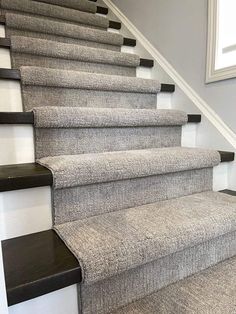 the carpeted stairs in this house are clean and ready to be used for cleaning