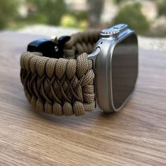 "Handcrafted with 100% Nylon Paracord \"MADE IN USA\".   Our Products include:    ➖Custom handcrafted watch bands \"According to You\". No matter how small or big your wrist size, we will craft your perfect fitting band (wrist size picture measurement required).  ➖Variety of styles to choose from. You may order your band \"As pictured\", or feel free to request changes. If you don't see your favorite style in our page or watch category yet, please contact us and we can discuss your options.  ➖Va Durable Adjustable Apple Watch Band For Outdoor, Outdoor Apple Watch Band, Adjustable Silver Watch Bands For Outdoor Use, Customizable Adjustable Apple Watch Band For Outdoor, Paracord Watch, Handmade Watch Bands, Apple Watch Sizes, Handmade Watch, Apple Watch Accessories