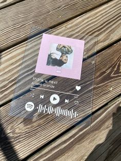 a wooden bench with a clear plastic cover on it and an image of a person's head