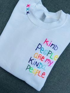 a white t - shirt with the words kind people are my kind of people on it