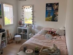 a bed room with a neatly made bed and desk