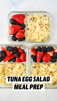 four plastic containers filled with food on top of a white counter next to strawberries and blackberries