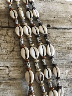 Natural wooden beads, cowrie shells and pearl beads beautifully coordinated on micro rope. It can also be adjusted to be a choker. Caramel Blonde, Cowrie Shells, Brown To Blonde, Cowrie Shell, Blonde Color, Miu Miu Ballet Flats, Beads Necklace, Wooden Beads, Pearl Beads