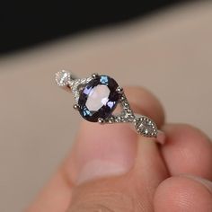 This is a gorgeous handmade creation. Its beauty is its simplicity & Elegance. The 6*8 mm oval shape faceted lab alexandrite is crafted in solid sterling silver and with rhodium plated. All item is sent in a beautiful gift box!!! If you have any idea of design your ring,pls contact me directly. Oval Amethyst Cubic Zirconia Promise Ring, Oval Amethyst Ring With Cubic Zirconia For Promise, Oval Purple Sapphire Rings, Purple Sapphire Oval Ring, Elegant Oval Tanzanite Birthstone Ring, Oval Amethyst Ring With Cubic Zirconia Accent Stones, Oval Amethyst Ring With Gemstone Accents For Promise, Oval Crystal Ring With Gemstone Accents For Promise, Sapphire Oval Crystal Ring With Accent Stones