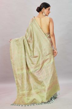 Look your ethnic best at weddings and special occasions in this beautiful Pistachio green Tanchoi Banarasi silk saree. It is enhanced with zari border and comes with a matching blouse piece. Disclaimer: The shown stitched blouse on the model is for display purpose only. The saree comes with a matching blouse piece and finished with fall and piko. Festive Pista Green Banarasi Silk Pre-draped Saree, Green Semi-stitched Pre-draped Saree With Meenakari, Green Bollywood Pre-draped Saree With Meenakari, Green Paithani Silk Pre-draped Saree With Self Design, Pista Green Tussar Silk Pre-draped Saree With Pallu, Green Silk Saree With Meenakari, Diwali Pista Green Tussar Silk Pre-draped Saree, Green Art Silk Traditional Wear With Chikankari Embroidery, Bollywood Style Pista Green Pre-draped Saree In Tussar Silk