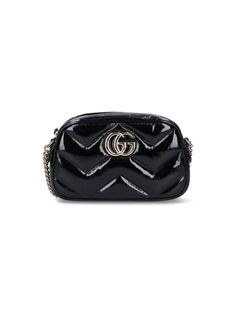 Gucci 'GG Marmont' small shoulder bag in black quilted patent leather with gold metal details, all-over Chevron pattern, adjustable chain shoulder strap, double G logo patch on the front, zip puller closure, main inner compartment, inner slip pocket. composition: 100% leathersize and fit: h 13 x w 24 x d 7 cm Designer Gucci Quilted Bags, Luxury Quilted Gucci Bag, Formal Quilted Gucci Bag, Gucci Quilted Formal Shoulder Bag, Gucci Black Shoulder Bag With Zipper Closure, Black Gucci Shoulder Bag With Zipper Closure, Formal Gucci Shoulder Bag With Zipper Closure, Chic Gucci Shoulder Bag With Metal Logo, Gucci Luxury Bags With Zipper Closure