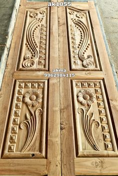 two wooden doors with carvings on them and the bottom one is made out of wood