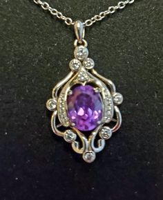 "Beautiful Purple Alexandrite Color Changing From Purple To Magenta Pink, Lab Created Stone 8x10mm In Vintage Style .925 Sterling Silver Chandelier Design Necklace. 18-20\" Sterling Chain." Purple Necklaces With Diamond Accents For Gift, Dazzling Gemstones With Diamond Accents As Gift, Dazzling Amethyst Jewelry Gift, Dazzling Amethyst Jewelry As A Gift, Dazzling Amethyst Jewelry For Gifts, Silver Oval Necklace With Sparkling Stones, Amethyst Jewelry With Diamond Accents As Gift, Oval Necklace With Sparkling Stones For Gift, Silver Diamond Necklaces With Accent Stones