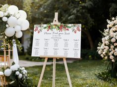 an easel with a wedding seating plan on it