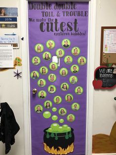 a bulletin board with pictures of people on it in front of a purple door that says double trouble to the trouble guest