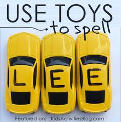 three yellow toy cars sitting next to each other on a white surface with the word lee written in black