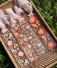 a basket filled with lots of different types of stickers on top of green grass