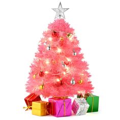 a pink christmas tree with presents under it