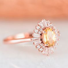 Beautiful Vintage Inspired Citrine Ring ►Base Metal: 925 Sterling Silver ►Plating: 14K Rose Gold Center Stone: Citrine Stone creation: Natural Stone shape: Oval Gem size: 7.0 x 5.0 mm Carat Weight: 0.76 ct. Accented With Simulated Diamonds ►Please be aware that plated jewelry can wear off over time, if this is a concern we would suggest going with the sterling silver or solid gold jewelry option https://www.etsy.com/listing/648153493/victoria-citrine-ring-sterling-silver?ga_search_query=citrine& Elegant Orange Sapphire Ring For Wedding, Elegant Orange Sapphire Wedding Ring, Oval Halo Ring, Popular Engagement Rings, Yellow Gemstones, 14k Rose Gold Ring, Gemstone Engagement, Citrine Ring, Citrine Stone