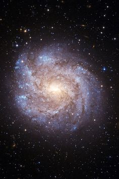 an image of a spiral galaxy in the sky