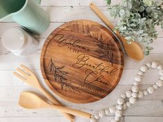 personalized cutting board with name on it next to utensils