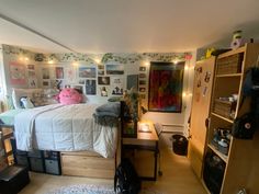 a bedroom with a bed, desk and shelves