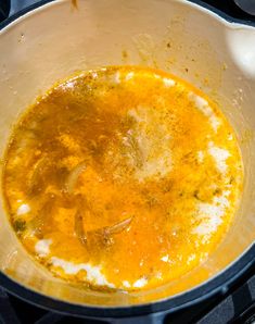 the food is being cooked in the pot on the stove