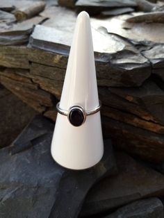 I love this design as a unisex ring. Its between a size V and w, so even unadjusted it's a big size. The band is slim, but sturdy so adjusting it won't be a problem. The setting is 9x5mm, oval in design and quite contemporary, so worn as an everyday piece or even as a dress ring, it's simplicity is very effective. As with all our rings it's 925 Sterling silver with gorgeous Whitby Jet. Adjustable Open Sapphire Ring, Adjustable Silver Ruby Ring, Adjustable Silver Sapphire Open Ring, Adjustable Classic Sterling Silver Midi Rings, Adjustable Classic Midi Rings Stamped 925, Adjustable Oval Sapphire Ring In Sterling Silver, Dress Ring, Unisex Ring, Dress Rings