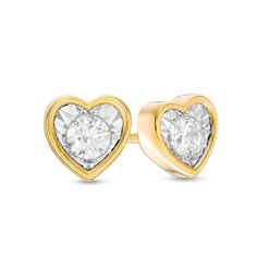 Send a romantic message with these diamond solitaire stud earrings. Crafted in warm 10K gold, each earring features a single diamond - artfully set to enhance size and sparkle - inside a bezel-look heart-shaped frame. Radiant with 1/6 ct. t.w. of diamonds and a brilliant buffed luster, these post earrings secure comfortably with friction backs. Yellow Gold Diamond Heart Earrings For Anniversary, Double Heart Diamond Earrings For Anniversary, Anniversary Double Heart Diamond Earrings, Yellow Gold Heart Diamond Earrings With Prong Setting, Yellow Gold Heart Cut Earrings With Diamond Accents, Heart Cut Yellow Gold Earrings With Diamond Accents, Classic Heart-shaped Diamond Earrings For Anniversary, Yellow Gold Brilliant Cut Heart Earrings For Anniversary, Yellow Gold Heart Earrings With Brilliant Cut For Anniversary