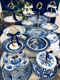 blue and white plates with gold decorations on them