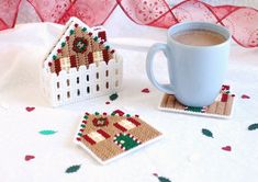 a cup of coffee and coasters on a table