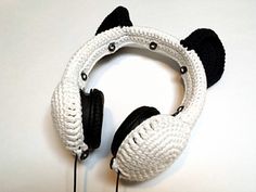 the headphones are knitted to look like panda ears