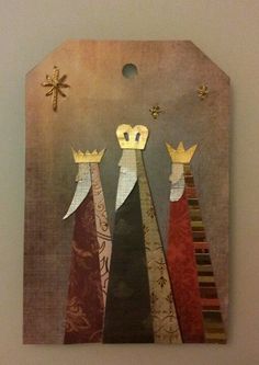 an image of three wise men with crowns on their heads hanging from a wall in a room