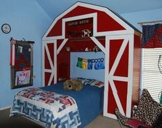 a room with a bed and a red barn