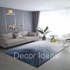 a living room filled with furniture and a large rug on top of a hard wood floor