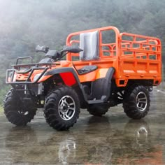 an orange four wheeler parked in the rain