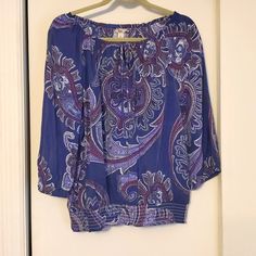 Bass & Co Purple Paisley Top. Elastic Bottom And 3/4 Length Sleeves. Round Neck With V Tie. (Neck Is Not Elastic) Casual Purple Top With Paisley Print, Casual Purple Paisley Print Top, Paisley Print Summer Top With 3/4 Sleeves, Fitted Button-up Paisley Print Blouse, Zipper Blouse, Spring V-neck Paisley Print Tops, Blue Paisley Print Button-up Top, Navy Blue Blouse, Off Shoulder Shirt