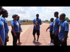 a group of young people standing around each other