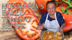 an older woman holding a tray of food in front of tomatoes and other vegetables with the words nonna pia's baked tomato recipe