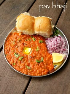 a plate full of food that includes bread and beans