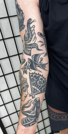 a man's arm with tattoos on it